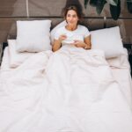 young-woman-resting-bed-morning-2-min