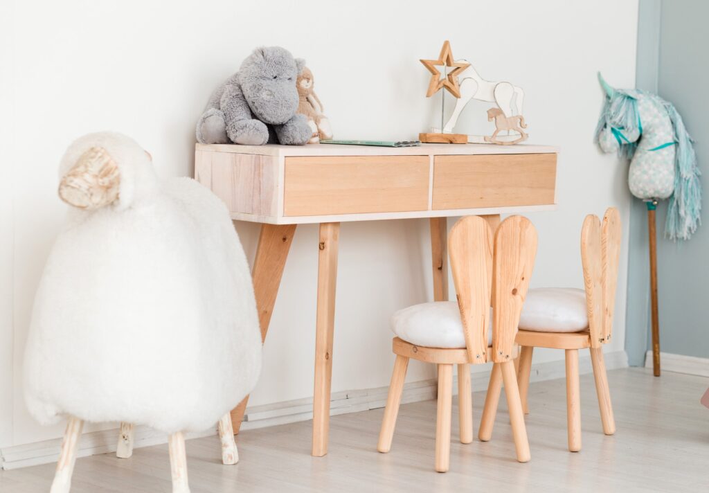 chairs-with-bunny-ears-children-room-table-with-toys-big-sheep-min