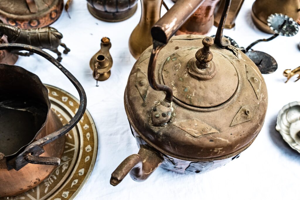 high-angle-view-antique-kitchen-utensils-table-min