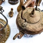high-angle-view-antique-kitchen-utensils-table-min